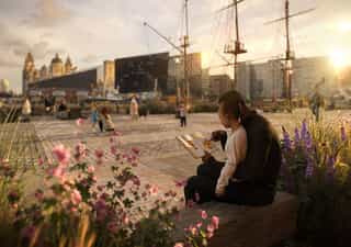 A visual of the future for Albert Dock, a dad reads to his daughter sat on a bench looking over the docks
