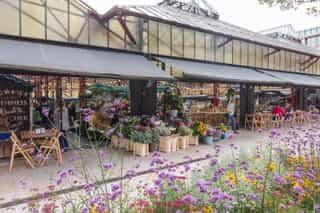 Altincham markt hall spilling out on to the street where new SuDS has been included