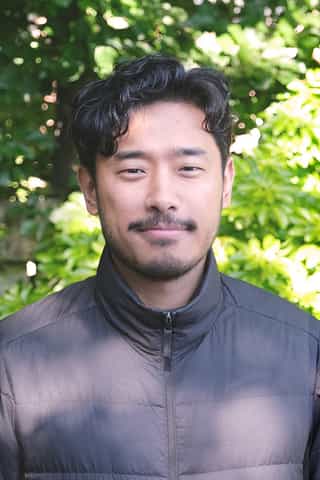 Headshot photo of Amrit Gurung