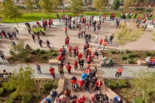 High angle photo overlooking the Anfield Stadium entrance, showing fans entering the building