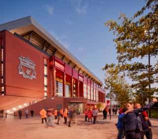 A photographic visual of Anfield stadium in the early evening.