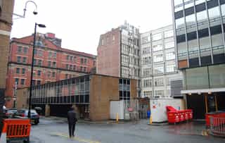 Before shot of a back alley in Manchester, where Sadler's Yard now sits.