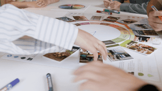 Video of members of the Planit team sat around a table and taking part in a workshop using the Planit Regenerative Design Tool